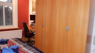 Ein Bett oder Betten in einem Zimmer der Unterkunft Ferienwohnung Freiberg, Chemnitzer Straße