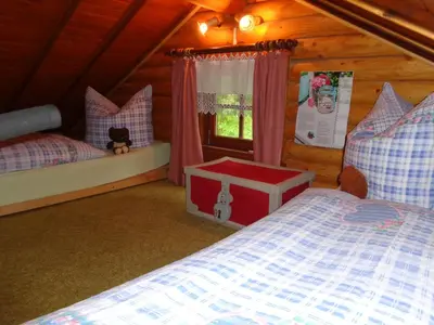 Ein Bett oder Betten in einem Zimmer der Unterkunft Ferienhaus Sachse
