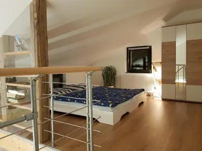 Ein Bett oder Betten in einem Zimmer der Unterkunft Ferienhaus Balkenkunst