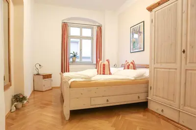 Ein Bett oder Betten in einem Zimmer der Unterkunft Apartment Am Markt 16, Bandusch-Szemák