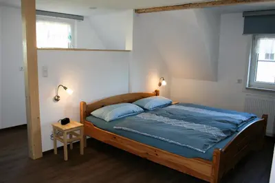 Ein Bett oder Betten in einem Zimmer der Unterkunft Zum-Seiffener-Sprengmeister