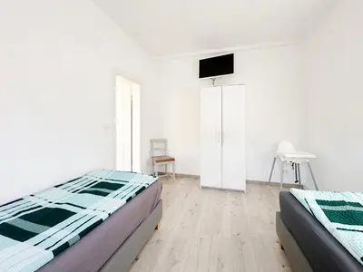 Ein Bett oder Betten in einem Zimmer der Unterkunft Ferienwohnung2 Grimma