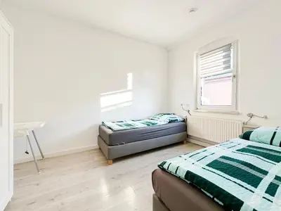 Ein Bett oder Betten in einem Zimmer der Unterkunft Ferienwohnung2 Grimma