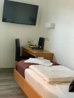 Ein Bett oder Betten in einem Zimmer der Unterkunft Hotel Bannewitz B&B
