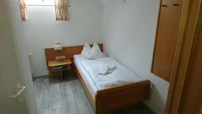 Ein Bett oder Betten in einem Zimmer der Unterkunft Pension Erbgericht