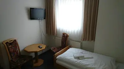 Ein Bett oder Betten in einem Zimmer der Unterkunft Pension Erbgericht