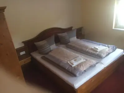 Ein Bett oder Betten in einem Zimmer der Unterkunft Restaurant & Pension 