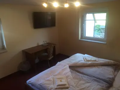 Ein Bett oder Betten in einem Zimmer der Unterkunft Restaurant & Pension 