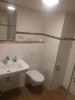 Ein Badezimmer in der Unterkunft Restaurant & Pension 