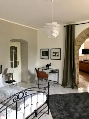 Ein Bett oder Betten in einem Zimmer der Unterkunft Ferienwohnung am Wasser Villa Graf von Pfeil