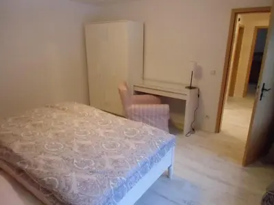 Ein Bett oder Betten in einem Zimmer der Unterkunft Ferienwohnung Simone