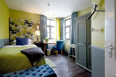 Ein Bett oder Betten in einem Zimmer der Unterkunft Fährhaus Meißen B&B
