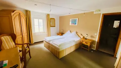 Ein Bett oder Betten in einem Zimmer der Unterkunft Hotel Erbgericht