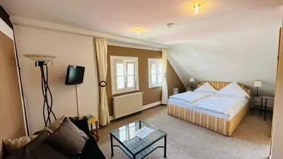 Ein Bett oder Betten in einem Zimmer der Unterkunft Hotel Erbgericht