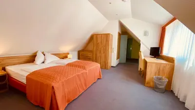 Ein Bett oder Betten in einem Zimmer der Unterkunft Hotel Erbgericht