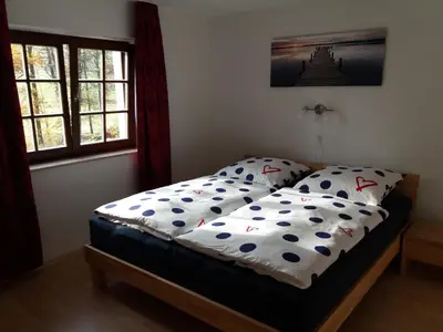 Ein Bett oder Betten in einem Zimmer der Unterkunft Ferienwohnung Wolf