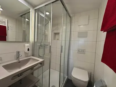Ein Badezimmer in der Unterkunft Hotel Folklorehof
