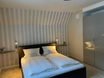 Ein Bett oder Betten in einem Zimmer der Unterkunft Villa Marie Ferienwohnungen
