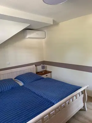 Ein Bett oder Betten in einem Zimmer der Unterkunft Ferienwohnungen Siebenlehn am Romanus Freibad