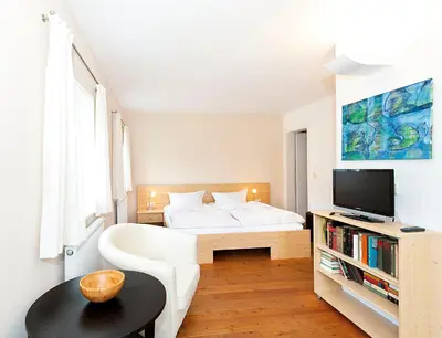 Ein Bett oder Betten in einem Zimmer der Unterkunft Fährmannhaus