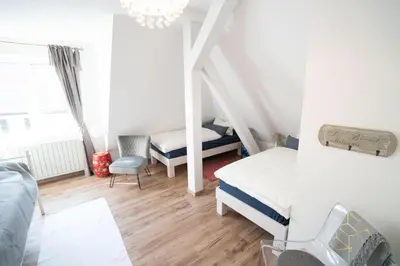 Ein Bett oder Betten in einem Zimmer der Unterkunft Villa Golding - Flat 3