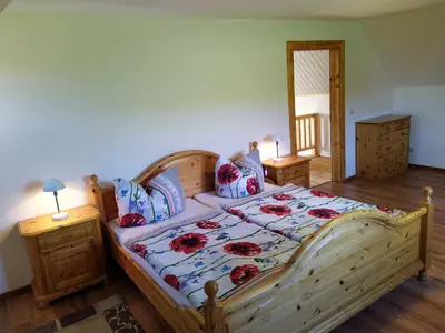 Ein Bett oder Betten in einem Zimmer der Unterkunft Ferienhaus Ebenheit am Lilienstein