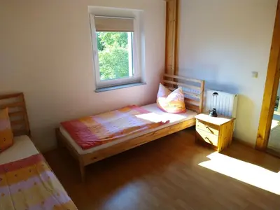 Ein Bett oder Betten in einem Zimmer der Unterkunft Ferienhaus Ebenheit am Lilienstein