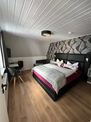 Ein Bett oder Betten in einem Zimmer der Unterkunft Pension Triebischtal