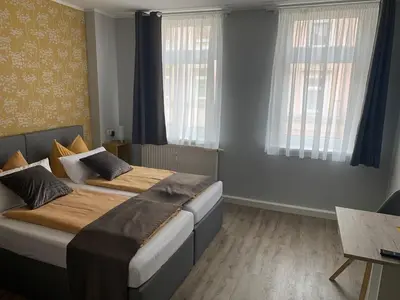Ein Bett oder Betten in einem Zimmer der Unterkunft Pension Triebischtal