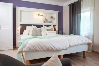 Ein Bett oder Betten in einem Zimmer der Unterkunft Landhotel Rosenschänke