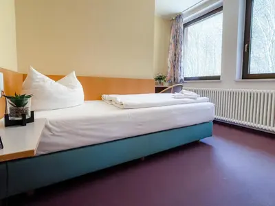 Ein Bett oder Betten in einem Zimmer der Unterkunft Aktiv-Hotel Stock & Stein