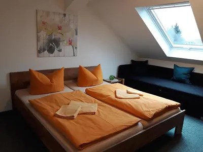 Ein Bett oder Betten in einem Zimmer der Unterkunft Gästehaus Heidi