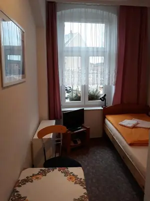 Ein Bett oder Betten in einem Zimmer der Unterkunft Gästehaus Heidi