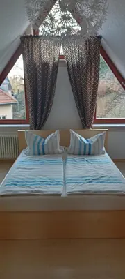 Ein Bett oder Betten in einem Zimmer der Unterkunft Winzerhaus Rissweg 15