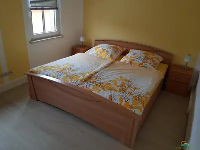 Ein Bett oder Betten in einem Zimmer der Unterkunft FeWo 