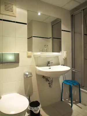 Ein Badezimmer in der Unterkunft Pension Ottendorf-Okrilla