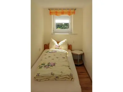 Ein Bett oder Betten in einem Zimmer der Unterkunft Ferienwohnung Basteiblick in Pirna