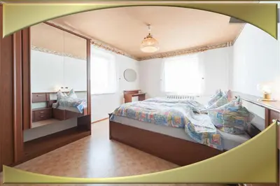 Ein Bett oder Betten in einem Zimmer der Unterkunft Ferienwohnung
