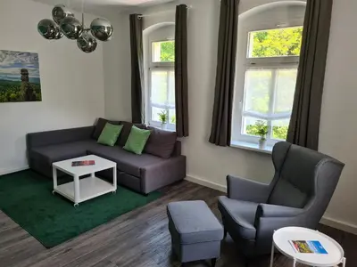 Ein Sitzbereich in der Unterkunft Apartmenthaus Luise