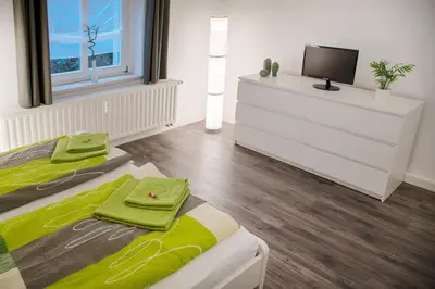 Ein Bett oder Betten in einem Zimmer der Unterkunft Apartmenthaus Luise
