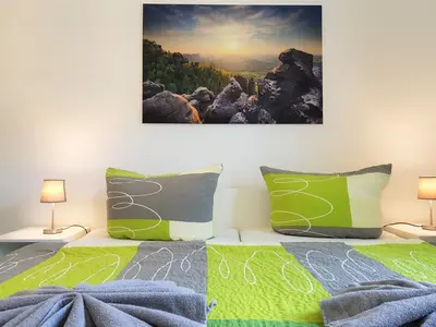 Ein Bett oder Betten in einem Zimmer der Unterkunft Apartmenthaus Luise
