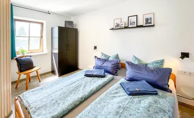 Ein Bett oder Betten in einem Zimmer der Unterkunft FeWoMaurer WG2 Erdgeschoss