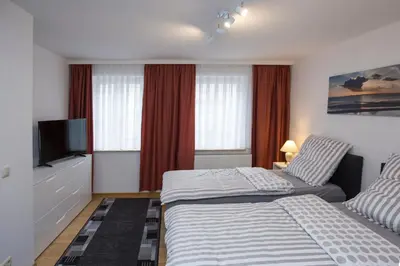 Ein Bett oder Betten in einem Zimmer der Unterkunft Ferienwohnungen Grimma 4