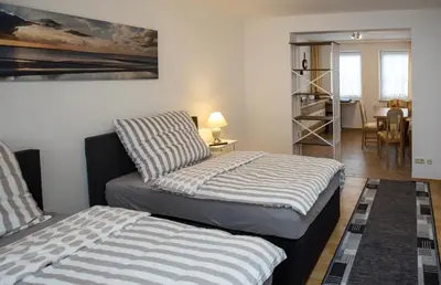 Ein Bett oder Betten in einem Zimmer der Unterkunft Ferienwohnungen Grimma 4