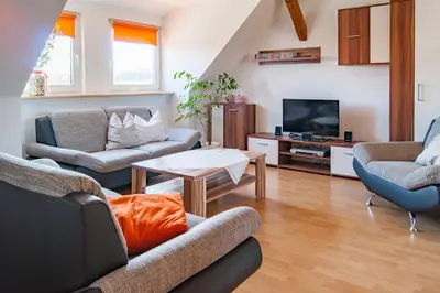 Ein Sitzbereich in der Unterkunft Dreiseitenhof Ferienwohnung Künzel