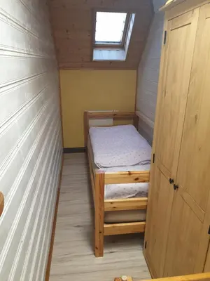 Ein Bett oder Betten in einem Zimmer der Unterkunft Erzgebirgshütte
