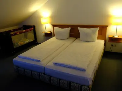 Ein Bett oder Betten in einem Zimmer der Unterkunft Landhaus Lockwitzgrund