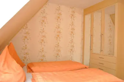 Ein Bett oder Betten in einem Zimmer der Unterkunft Ferienwohnung Neubert