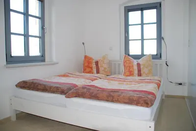 Ein Bett oder Betten in einem Zimmer der Unterkunft Gutshof Lesch, Fewo3 OG links