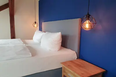 Ein Bett oder Betten in einem Zimmer der Unterkunft Aparthotel Mitte